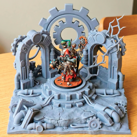 Detailed model with mechanical elements and a central figure on a wooden surface