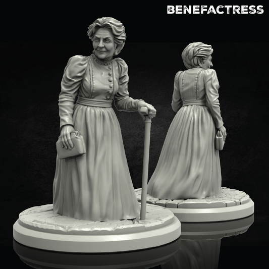 Statue of a woman in a dress with a cane, labeled 'Benefactress', on a reflective surface.