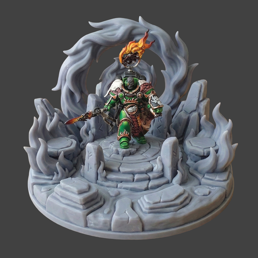 A fantasy tabletop miniature figurine of a green-armored warrior standing on a stone platform, surrounded by gray icy rock formations and a swirling gray energy ring, with orange flames rising from a helmet above the figure.