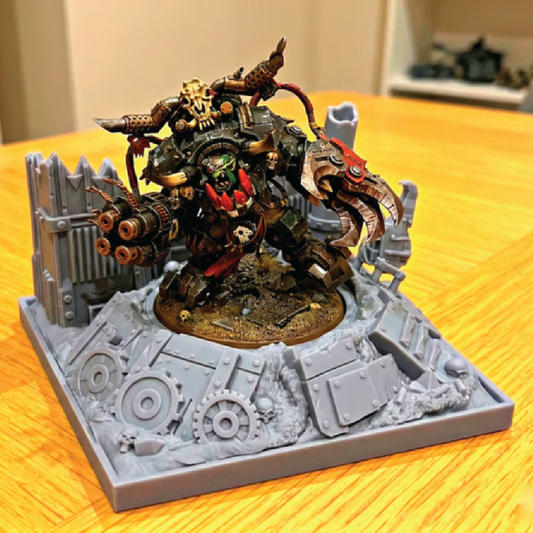 Detailed model of a mechanical creature on a gray base with gears, on a wooden surface.