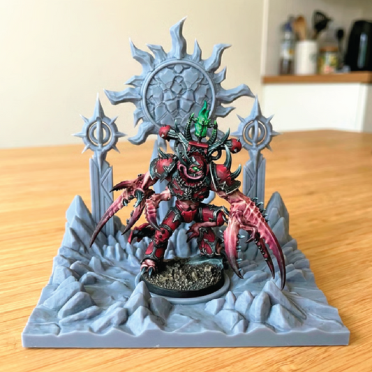 Fantasy figurine on a throne-like stand on a wooden surface