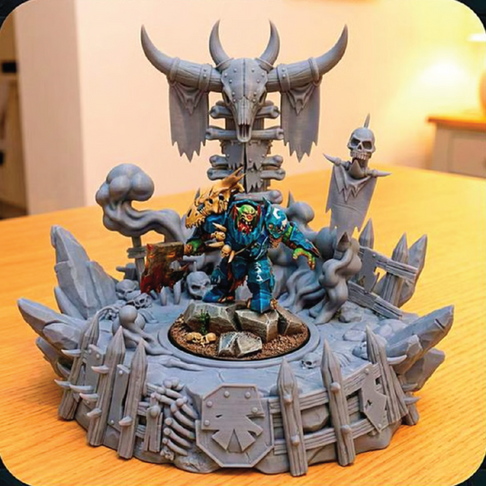 Fantasy figurine scene with a central character in a colorful outfit, surrounded by gray stone-like structures on a yellow surface.