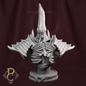Gray fantasy sculpture on a dark background
