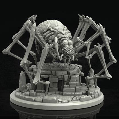 A gray 3D-printed unpainted miniature of a monstrous spider-like creature with large bone-like legs and a skull-like head, standing over a ruined stone pedestal on a circular base against a black background.