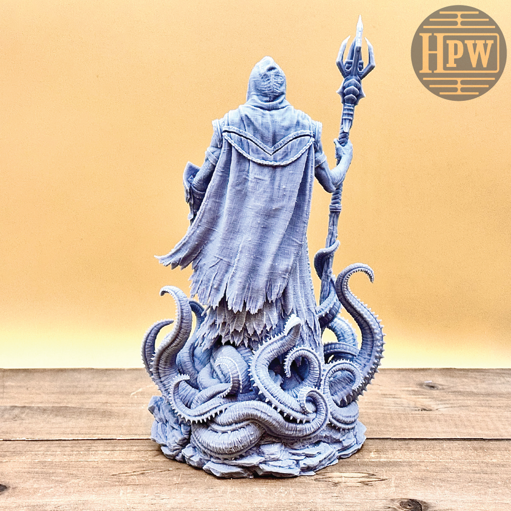 Statue of a hooded figure with tentacles and a trident on a wooden surface, with 'HPW' logo in the corner.