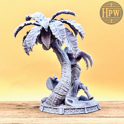 A goblin pirate wielding miniature blunderbusses standing under a palm tree and on top of an open treasure chest full of coins. This is a model 3D printed in gray UV resin.