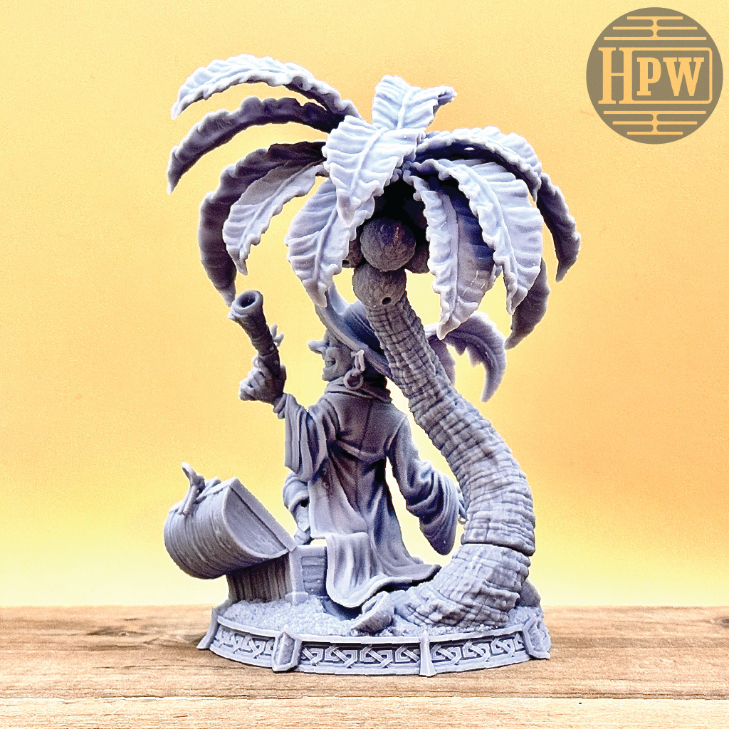 A goblin pirate wielding miniature blunderbusses standing under a palm tree and on top of an open treasure chest full of coins. This is a model 3D printed in gray UV resin.