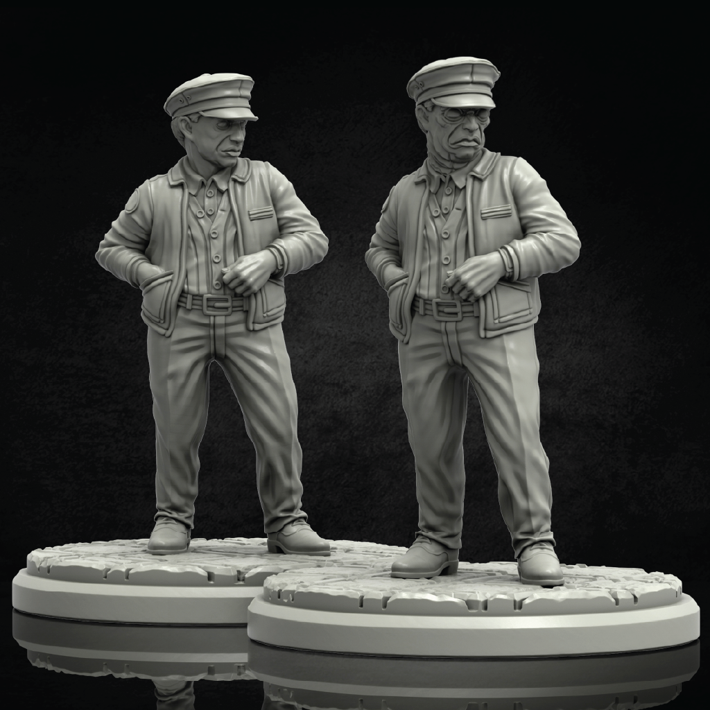 Two unpainted gray miniature figurines of elderly men in military-style uniforms standing on round bases against a dark studio background.