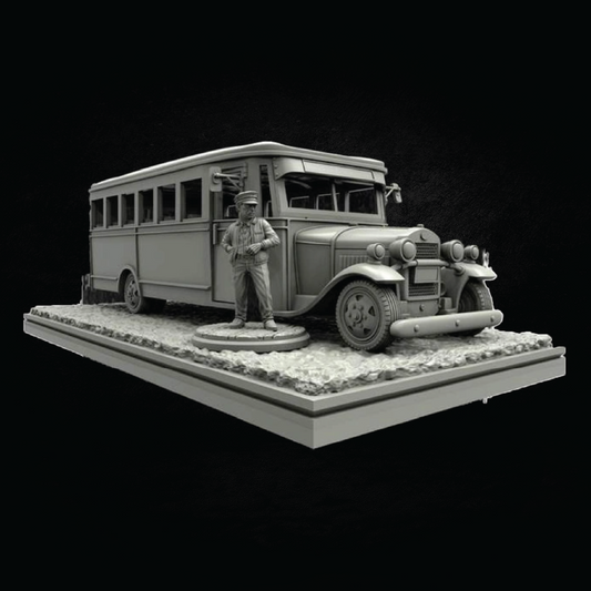 A monochrome miniature model of a vintage bus with a standing figure, displayed on a textured base against a black background.