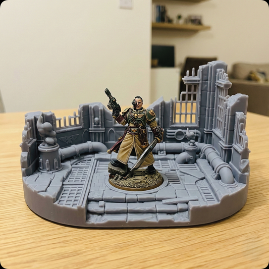 A painted fantasy tabletop miniature of a warrior holding a gun and sword, standing on a circular gray ruined city platform. The miniature is photographed on a light wood tabletop with a blurred indoor room in the background.