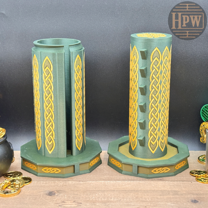 Two green and gold decorative candle holders on a wooden surface with 'HPW' branding.
