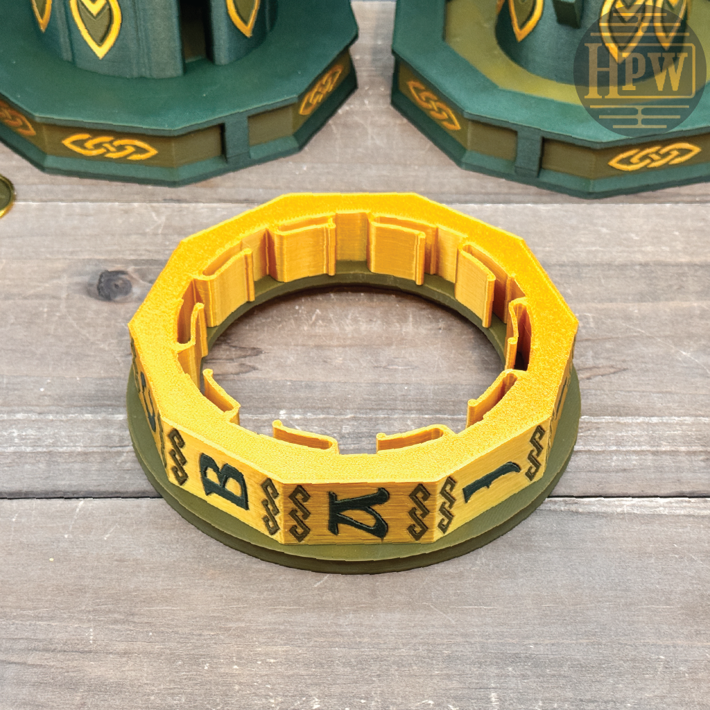 Yellow and green circular object with symbols on a wooden surface