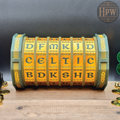 Decorative box with Celtic lettering on a wooden surface, branded 'HPW'.