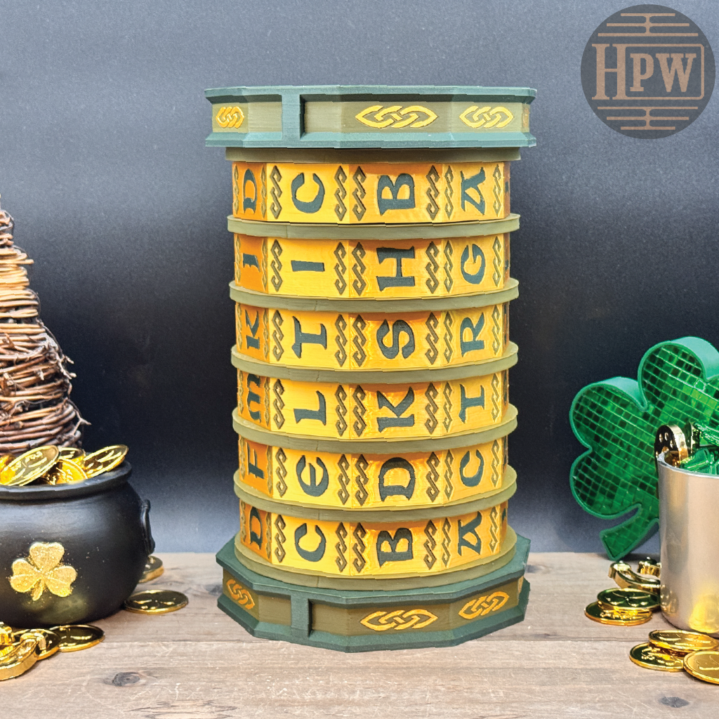 Stack of yellow and green lettered discs on a wooden surface with decorative items.