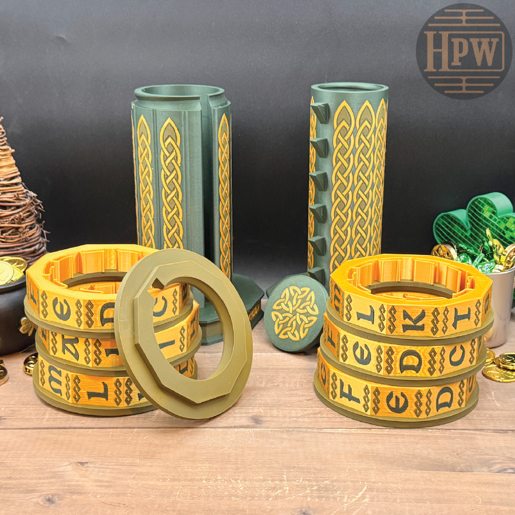 Decorative items with Celtic knot patterns on a wooden surface, featuring the brand 'HPW'.