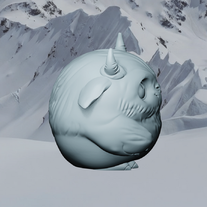 Snow sculpture of a creature with a unicorn horn against a snowy mountain background