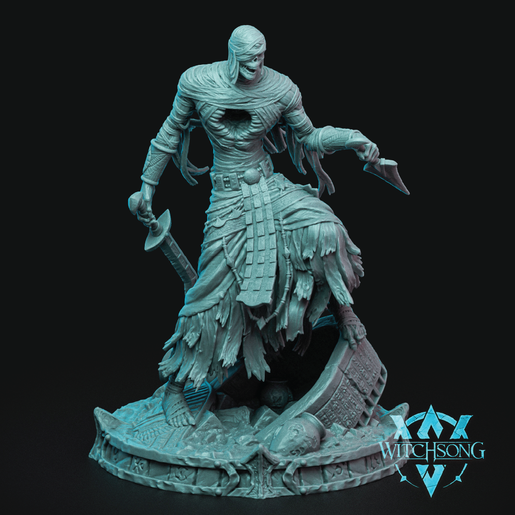 A fantasy miniature figurine of a skeletal warrior in tattered armor and skirt, holding a sword and dagger, standing on a detailed circular base. The figurine is painted in a pale icy blue color and is photographed against a solid black background.