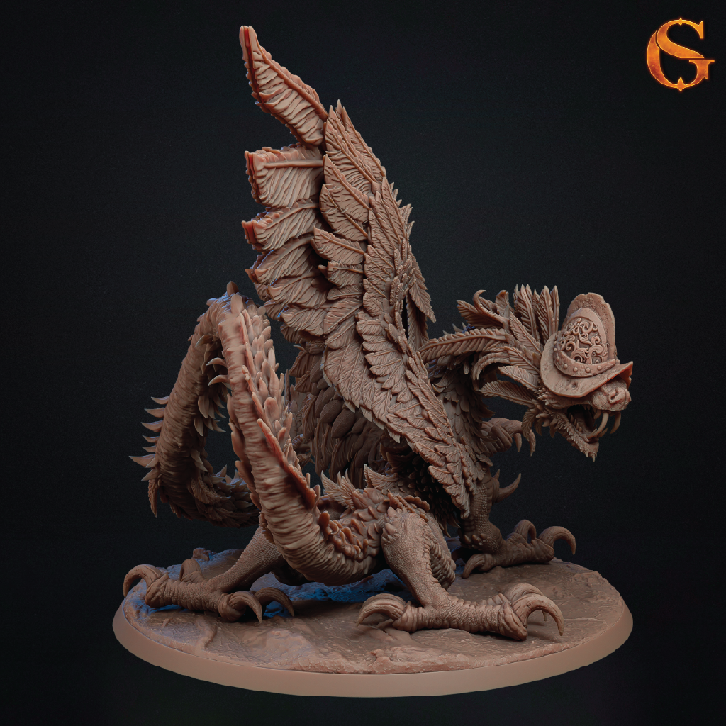A detailed fantasy creature miniature sculpture on a round base, shown against a dark studio background. The creature has textured brown and beige scales, large wing-like structures, sharp claws, and a decorative crest on its head.