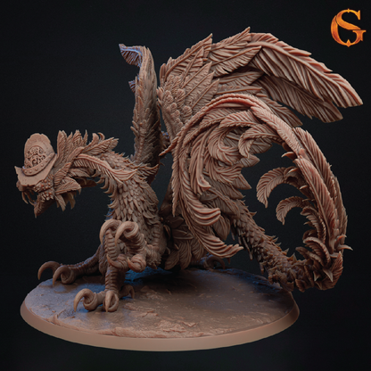 A detailed fantasy creature figurine or miniature sculpture with layered feathers, curved horns, and a small hat, shown on a round base against a dark background. A stylized orange 'G' logo appears in the top-right corner.