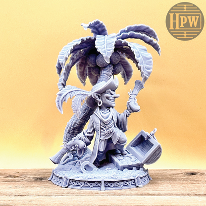 A goblin pirate wielding miniature blunderbusses standing under a palm tree and on top of an open treasure chest full of coins. This is a model 3D printed in gray UV resin.