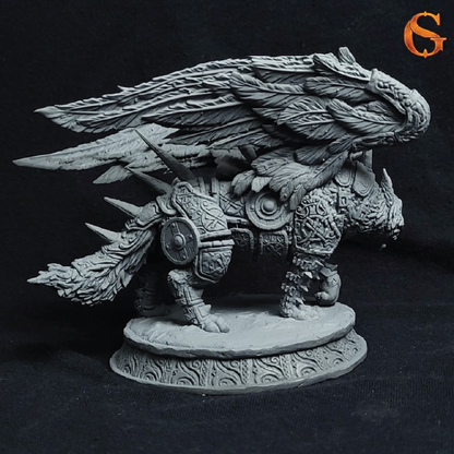 An unpainted gray fantasy miniature of a winged armored beast, likely a griffin or mechanical bird, standing on a decorative round base against a black background.