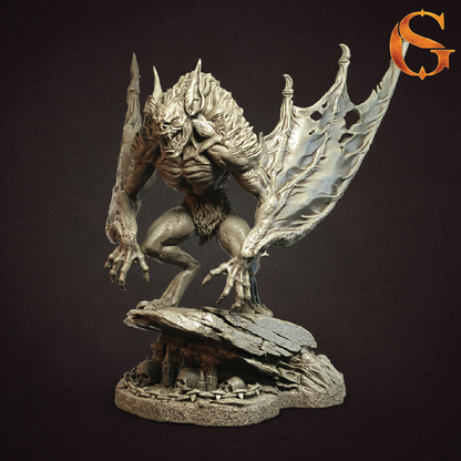A detailed fantasy monster figurine or 3D-printed model, shown in a crouching pose on a rocky base with skulls. The creature has large, tattered wings and a metallic silver-gray coloration, set against a dark brown background.