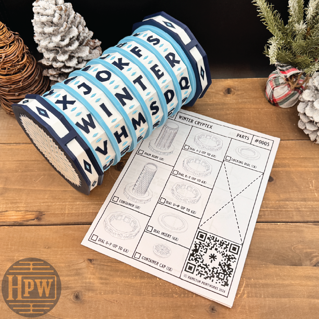 Decorative puzzle box with letter patterns on a wooden surface