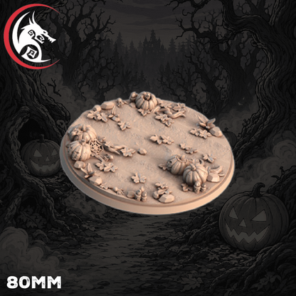 An 80mm round tabletop terrain piece featuring a Halloween theme with carved pumpkins, leaves, and small stones, shown floating against a dark illustrated forest background with jack-o'-lanterns. A red and black dragon logo is visible in the top-left corner, and '80MM' is printed in the bottom-left.