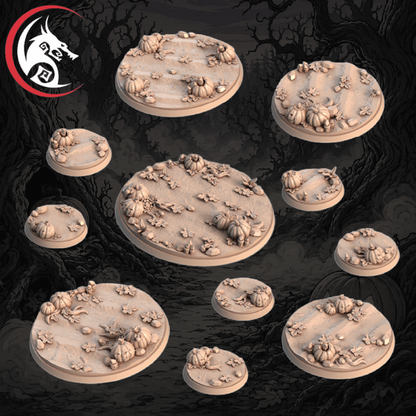Unpainted tabletop terrain miniatures bases, shown as pale beige round bases with Halloween-themed sculpt details like pumpkins, skulls, and leaves. The image has a dark spooky forest background with tree roots, a jack-o'-lantern, and a white red dragon logo.