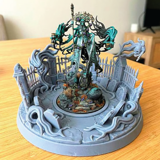 Fantasy figurine with detailed scenery on a wooden surface