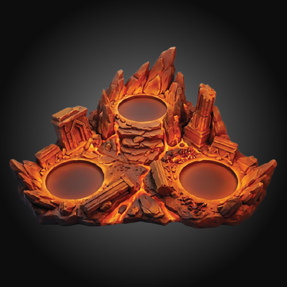 A 3D-printed fantasy miniature of a ruined mountain temple with three circular cup holders, glowing with warm orange light against a dark vignette background.