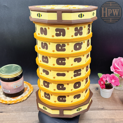 Stack of yellow and brown honeycomb-shaped containers on a wooden surface with a dark background.