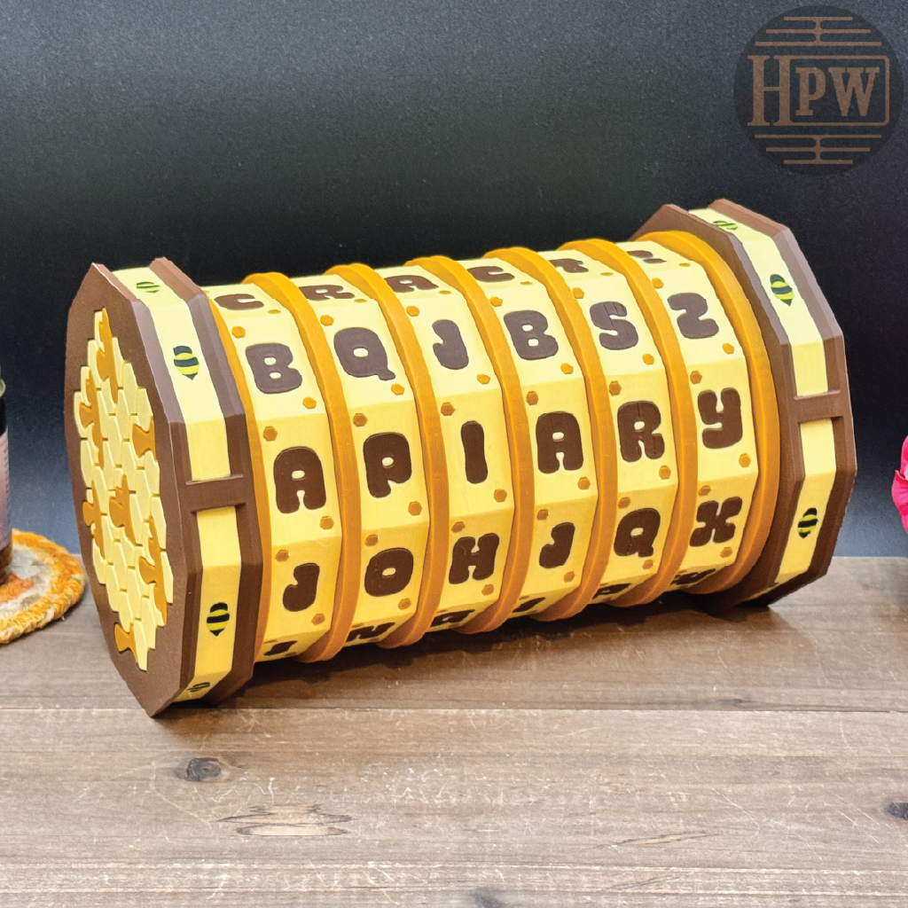 Wooden letter roll toy with letters on a wooden surface, branded HPW.