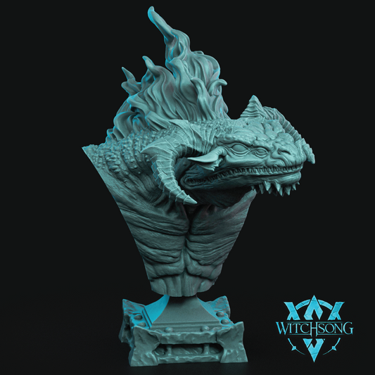 A detailed fantasy dragon bust sculpture in a metallic teal color, set against a solid black background with a Witchsong logo in the bottom right corner.