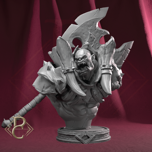 A monochrome gray fantasy warrior bust sculpture on a round pedestal, set against a draped dark red background. The figure has a muscular head and shoulders, a fierce snarling face, large angular armor plates, a horned helmet, and a large axe resting on the left.
