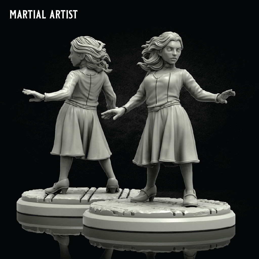 Two unpainted miniature figurines of women in combat poses on round bases, shown against a black background with the text 'MARTIAL ARTIST' in the top left corner.