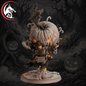 A stylized Halloween-themed fantasy figurine or collectible character standing on a round base, with a large carved pumpkin head, glowing orange eyes, dark armor, and a decorative crest. The background is a dark spooky forest scene with jack-o'-lanterns.