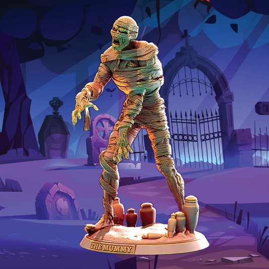 A stylized collectible statue of a mummy wrapped in bandages, posed in a graveyard scene on a display base labeled 'THE MUMMY'. The background shows a purple-toned haunted graveyard with tombstones and a gate.