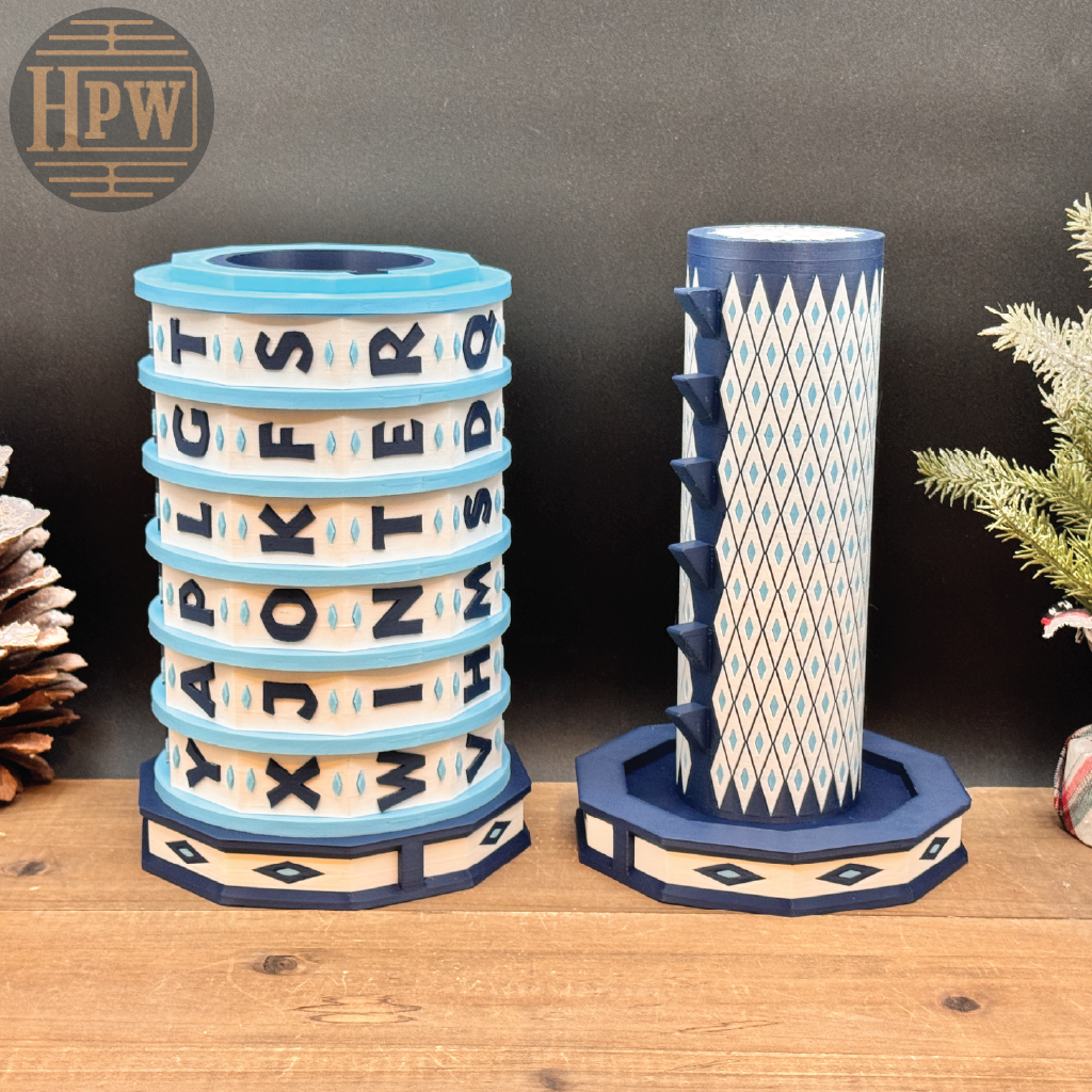 Decorative puzzle box with letter patterns on a wooden surface