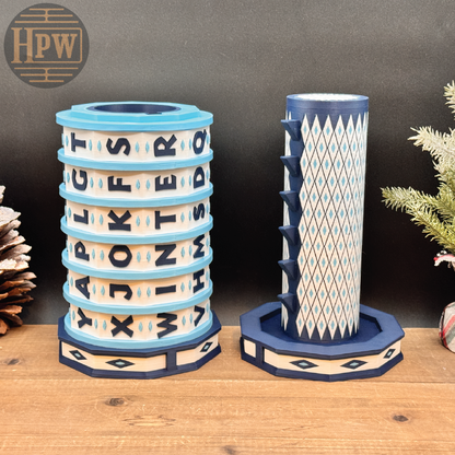 Decorative puzzle box with letter patterns on a wooden surface