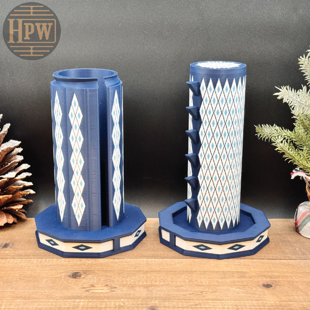 Decorative puzzle box with letter patterns on a wooden surface