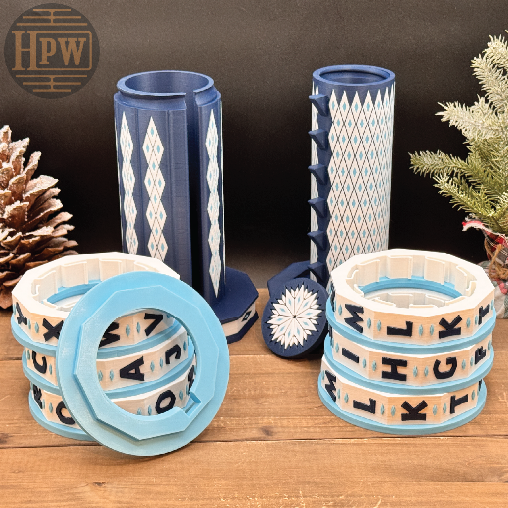 Decorative puzzle box with letter patterns on a wooden surface