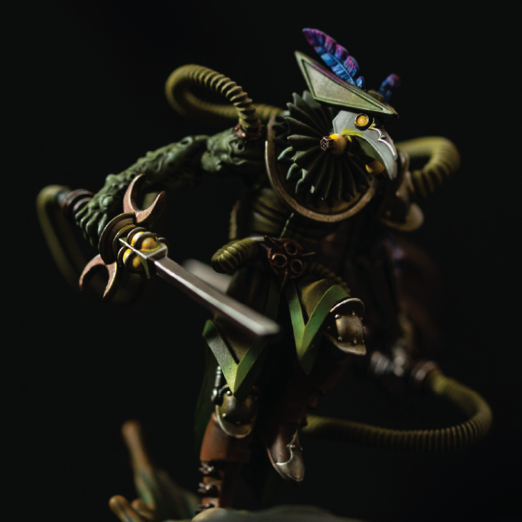 Detailed figurine with green and brown tones on a dark background
