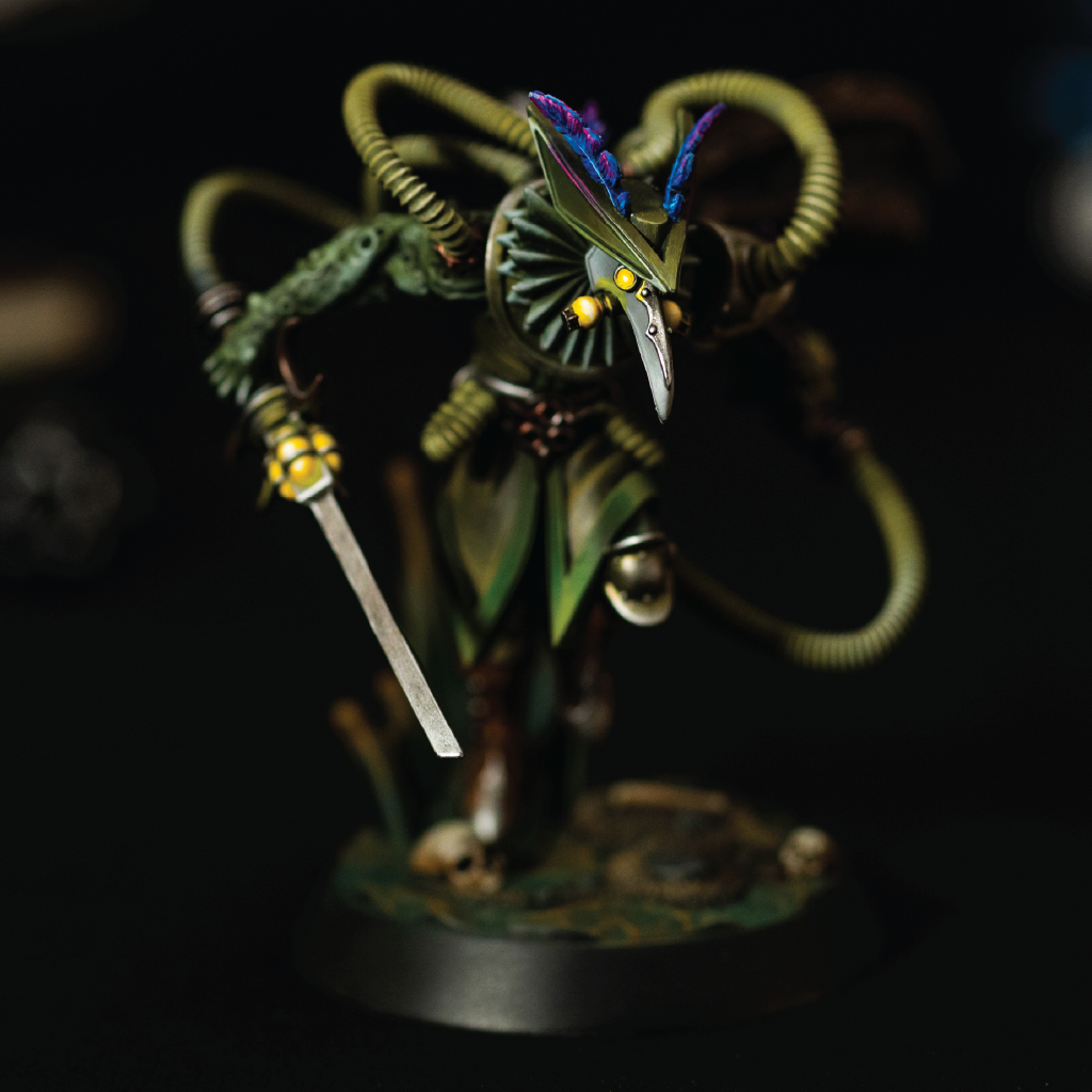 Detailed figurine with a sword on a dark background
