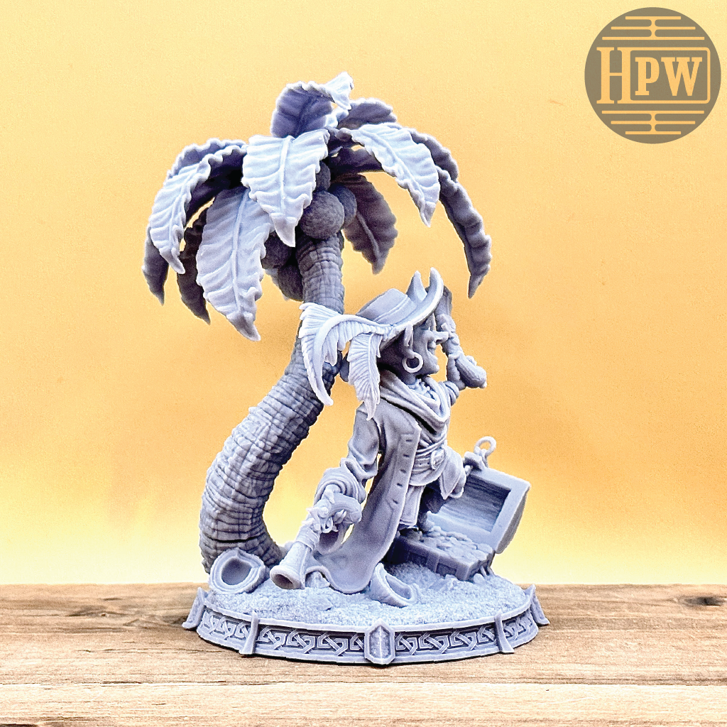 A goblin pirate wielding miniature blunderbusses standing under a palm tree and on top of an open treasure chest full of coins. This is a model 3D printed in gray UV resin.