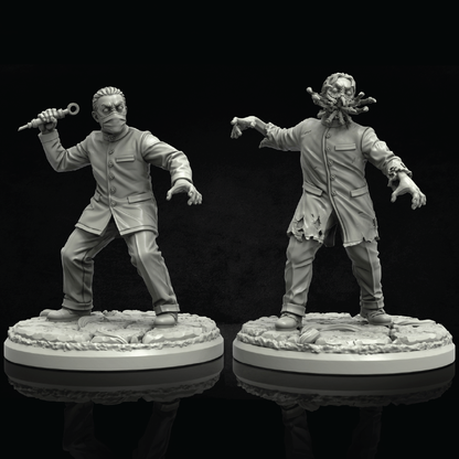 Two unpainted gray fantasy miniature figurines on round bases against a black background. One figure wears a suit and holds a knife, while the other has a grotesque mouth-like headpiece and tattered coat.