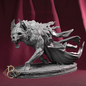 A gray fantasy creature figurine or 3D-printed model, shown in a dynamic crouching pose with a flowing tattered cloak, set against a dark red draped background.