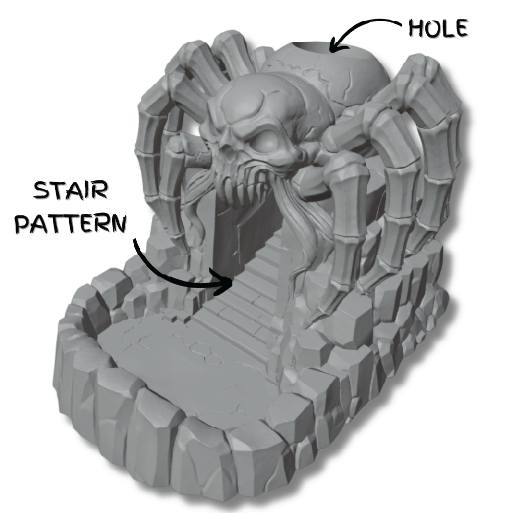 A render of a 3D model of a dice tower made of a craggy rock outcropping topped by a giant spider with a skull for a face, with arrows highlighting usability features