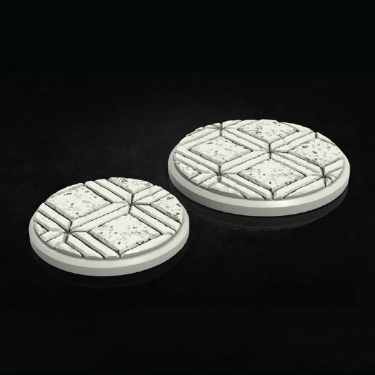 Two round, textured game bases on a black background