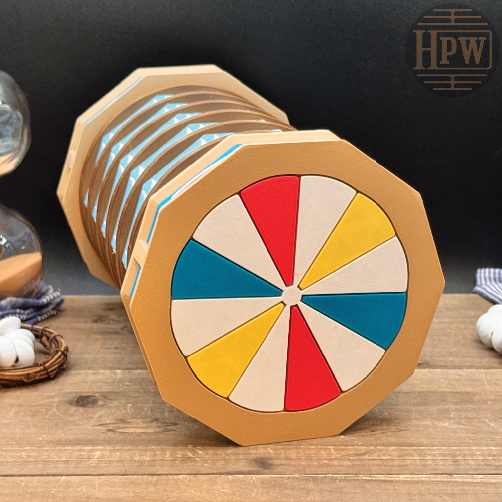 A wooden octagonal spinning wheel toy with a colorful wheel face in red, yellow, blue, and beige segments, displayed on a wooden surface with a dark background.